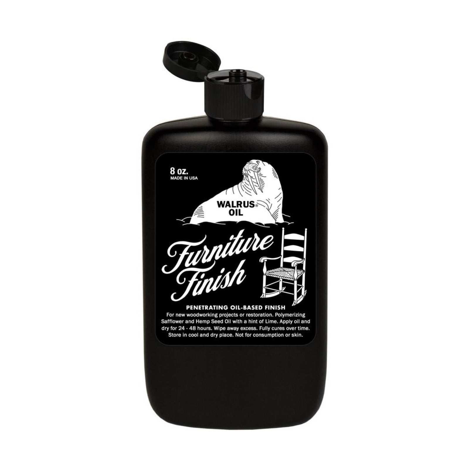 Bottle of Walrus Oil Furniture Oil on wood tabletop – natural finish